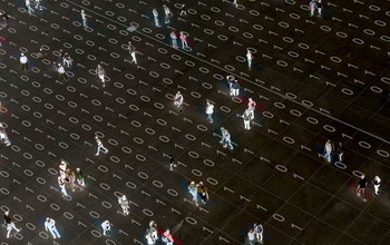 An overhead view of groups of people and individuals along with 0s and 1s representing binary information.